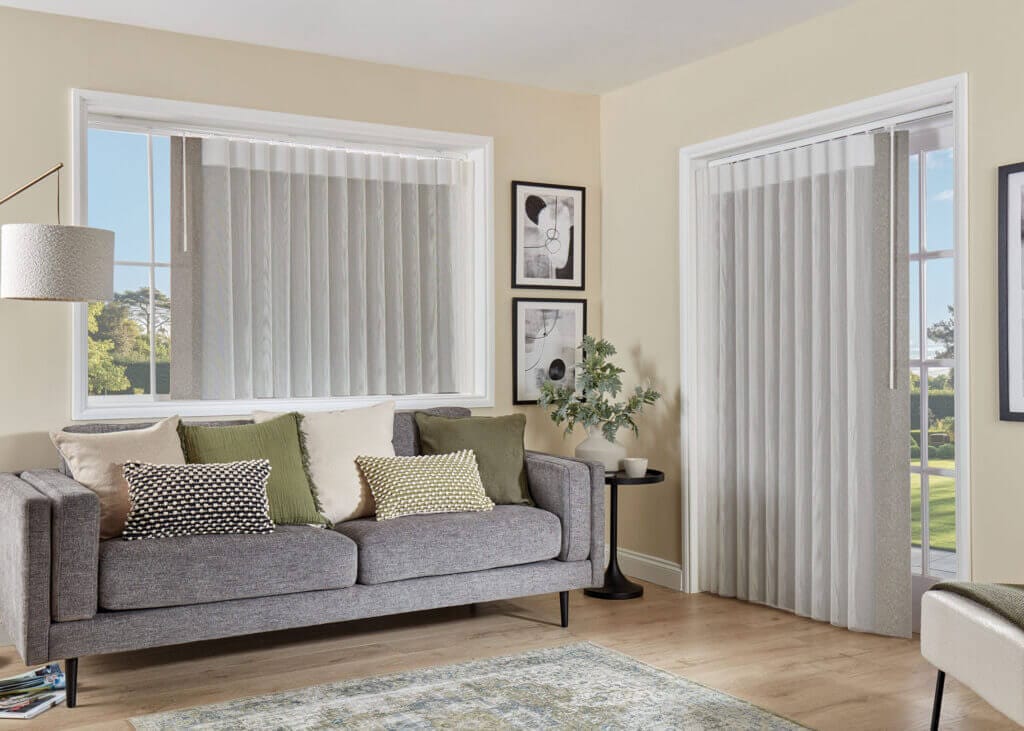 white allusion blinds in a living room over a patio door and window