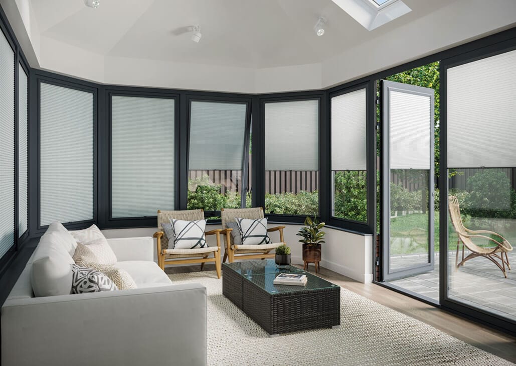 Modern conservatroy with black frames fitted with white cellular blinds